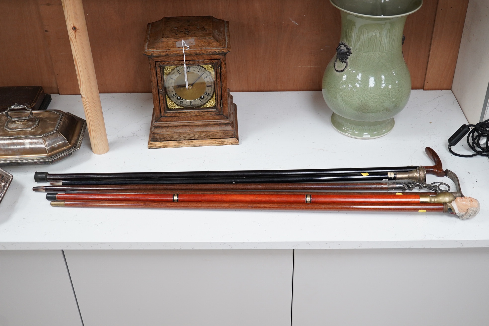 Six walking sticks, one with a plated snuff box handle, a stick with hidden glass flask, a stick with a handle in the form of a Georgian gentleman, etc. longest 95cm. Condition - fair to good